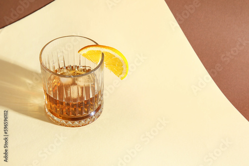 Whiskey glass with ice and ...