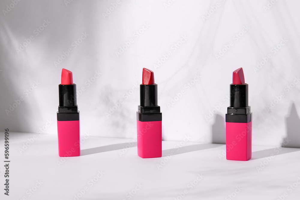 Set of beautiful lipsticks on light background Set of beautiful lipsticks on light background