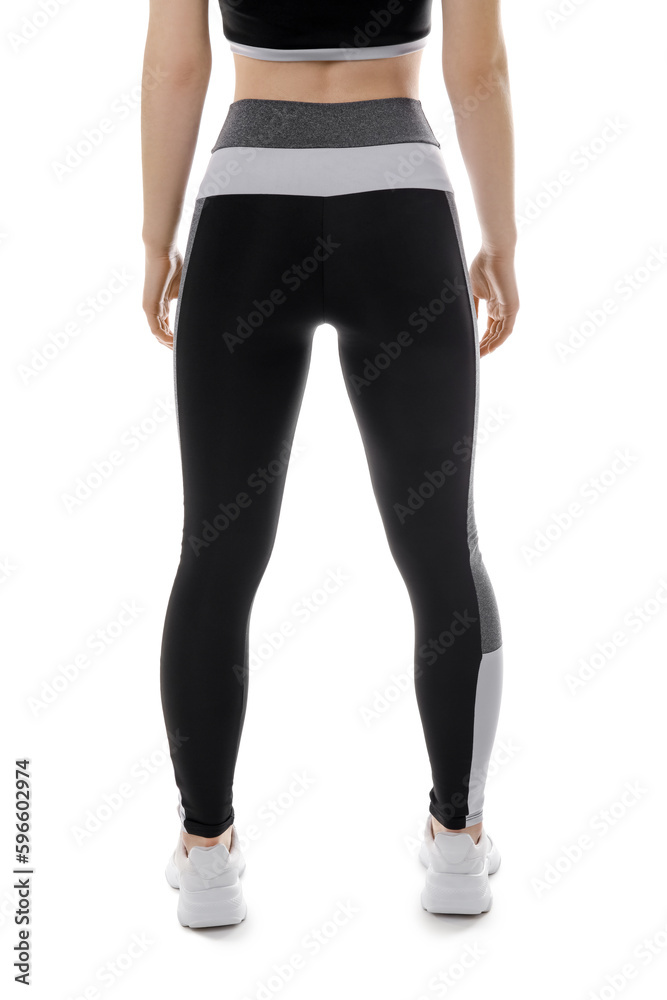 Sporty young woman in leggings on white background, back view Sporty young woman in leggings on white background, back view