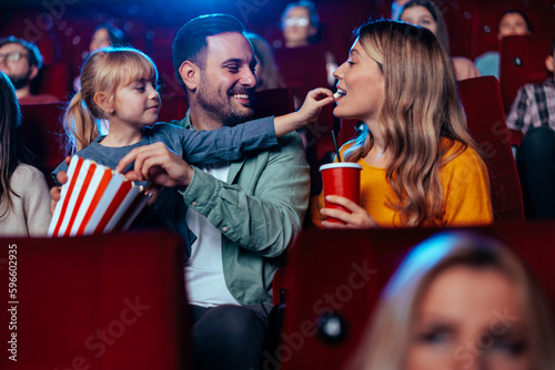 Family having fun at movies.