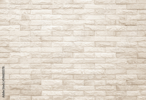 Cream and white brick wall texture background. Brickwork and stonework flooring interior rock old pattern design. © siripak
