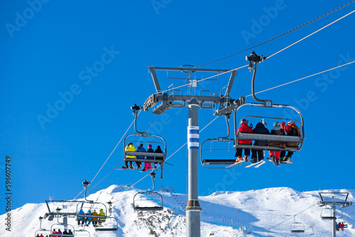 Skiers using the ski lift at Grandvalira ski resort in Pas de la Casa photo