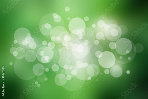 Abstract green background with glowing round bokeh. Natural background.