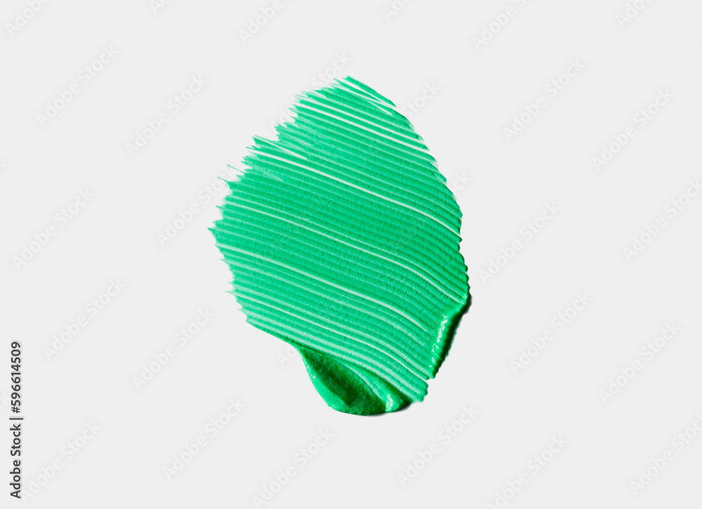 Green liquid cosmetic creamy pigment make up or hair color or mask or wax isolated on gray Green liquid cosmetic creamy pigment make up or hair color or mask or wax isolated on gray