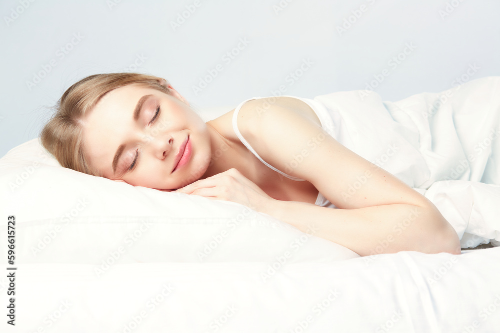 Young beautiful girl sleeps in the bedroom. Young beautiful girl sleeps in the bedroom.