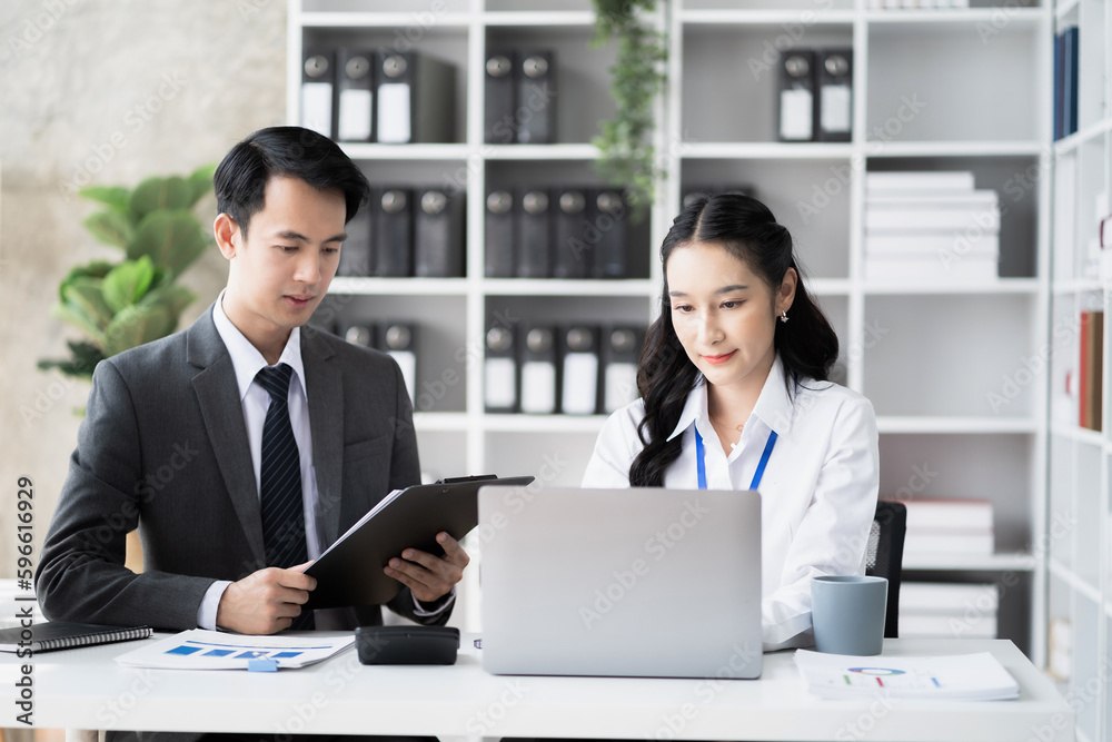 Businessmen team or financial data analysts working with tablets and laptop computers and data graphs together. Plan to analyzing projects in the office. Businessmen team or financial data analysts working with tablets and laptop computers and data graphs together. Plan to analyzing projects in the office.