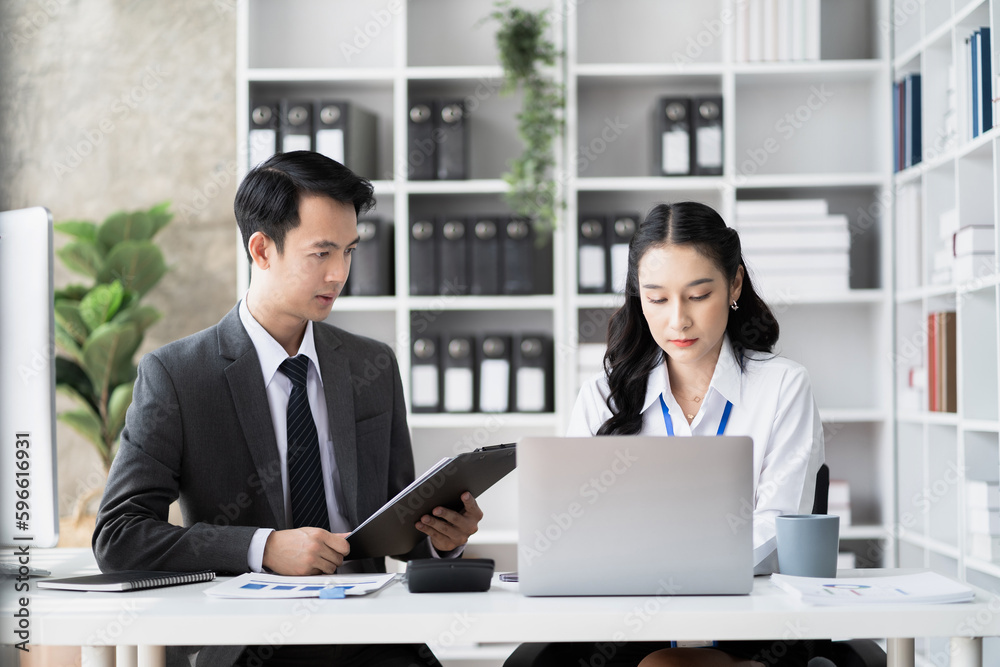Businessmen team or financial data analysts working with tablets and laptop computers and data graphs together. Plan to analyzing projects in the office. Businessmen team or financial data analysts working with tablets and laptop computers and data graphs together. Plan to analyzing projects in the office.