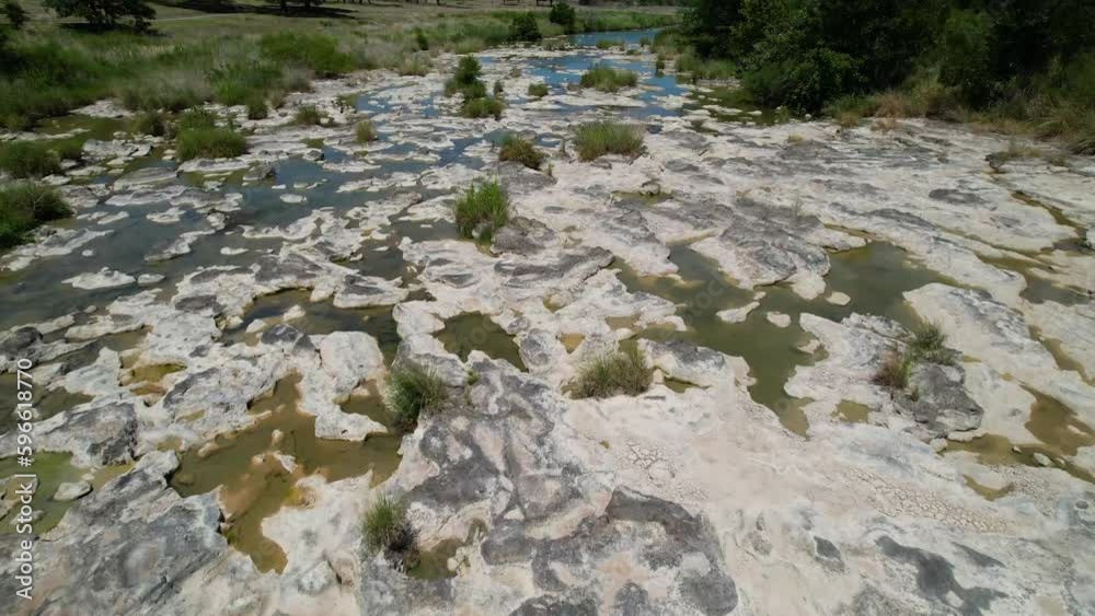 Aerial flight over a shallow portion of the Pedernales River in Stonewall Texas. Aerial flight over a shallow portion of the Pedernales River in Stonewall Texas.