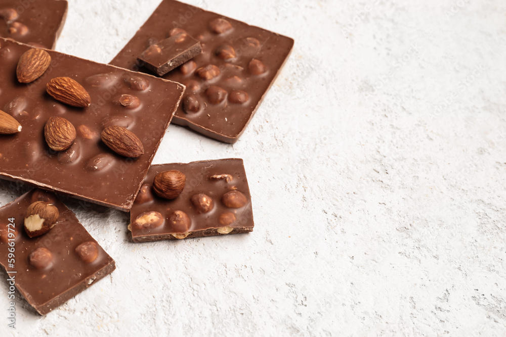 Sweet tasty chocolate with nuts on light background Sweet tasty chocolate with nuts on light background