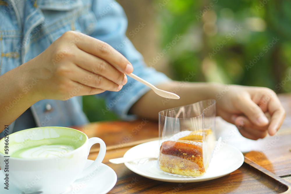Woman eating cake in coffee cafe Woman eating cake in coffee cafe