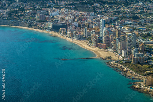 modern apartments, Cantal Roig beach and sailboats and fishing boats in the port of Calpe. Top view, horizontal © Piotr