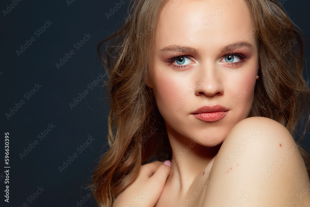 Portrait of beautiful woman model with fresh daily makeup and romantic wavy hairstyle. Portrait of beautiful woman model with fresh daily makeup and romantic wavy hairstyle.