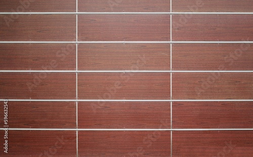 Stoneware tile panels with wood effect for ventilated walls or facades. Background and texture.