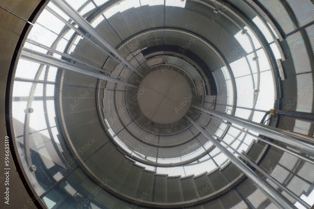 Fototapeta premium Uprisen view of spiral staircase, look like an eye of giant machine