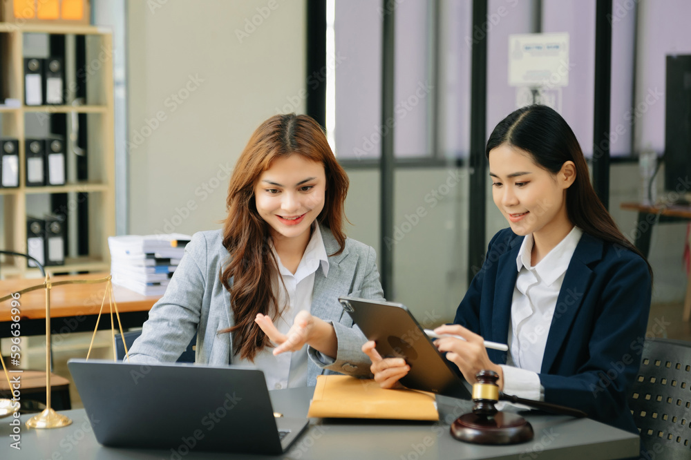 business asian team and lawyers discussing contract papers sitting at the table. Concepts of law, advice, legal services.