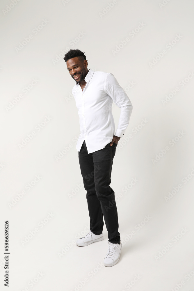Optimistic African American young man. Good emotions concept. Vertical mock-up Optimistic African American young man. Good emotions concept. Vertical mock-up