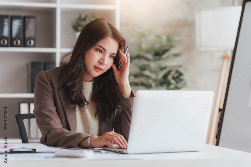 Accountant woman working on laptop and do document look stress, tax, exchange, research, accounting and Financial advisor concept Accountant woman working on laptop and do document look stress, tax, exchange, research, accounting and Financial advisor concept