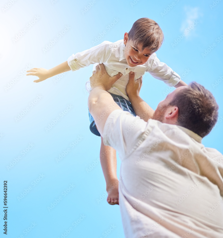 Reach for the stars. Shot of a young father and son spending time together outside. Reach for the stars. Shot of a young father and son spending time together outside.