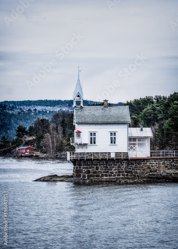 The Historic Heggholmen Wooden Harbour Lighthouse At Oslofjord, Oslo, Norway photo