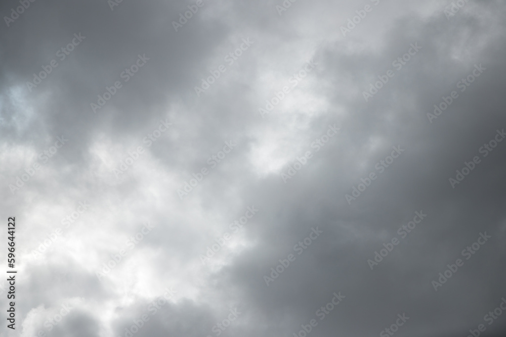 Dramatic background caused by dark clouds in the sky. Forecast of rain, thunderstorm, bad weather. The beauty of nature. Abstract background image.