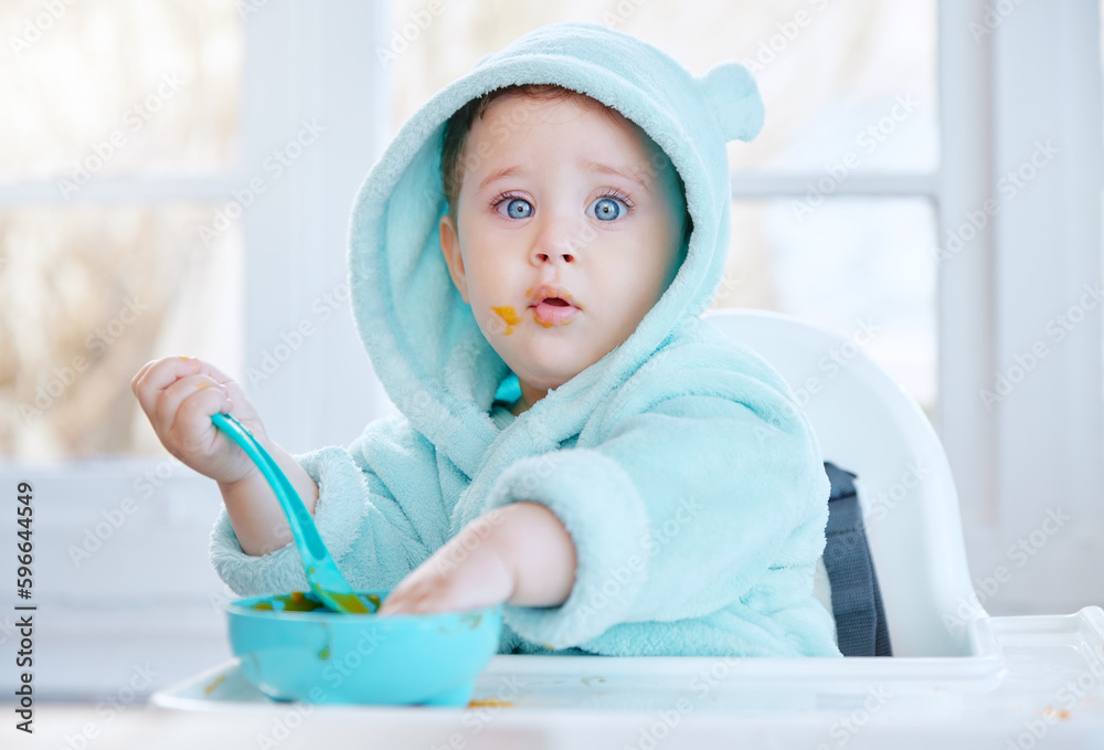Its so delicious that I want to lick the bowl clean. Shot of an adorable baby boy eating his food. Its so delicious that I want to lick the bowl clean. Shot of an adorable baby boy eating his food.