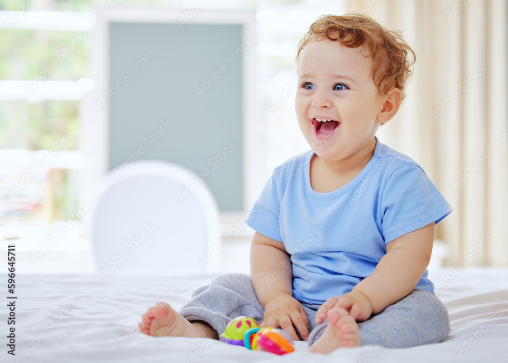 Hes a bundle of laughs. Full length shot of an adorable little boy playing in his parents bedroom at home. Hes a bundle of laughs. Full length shot of an adorable little boy playing in his parents bedroom at home.