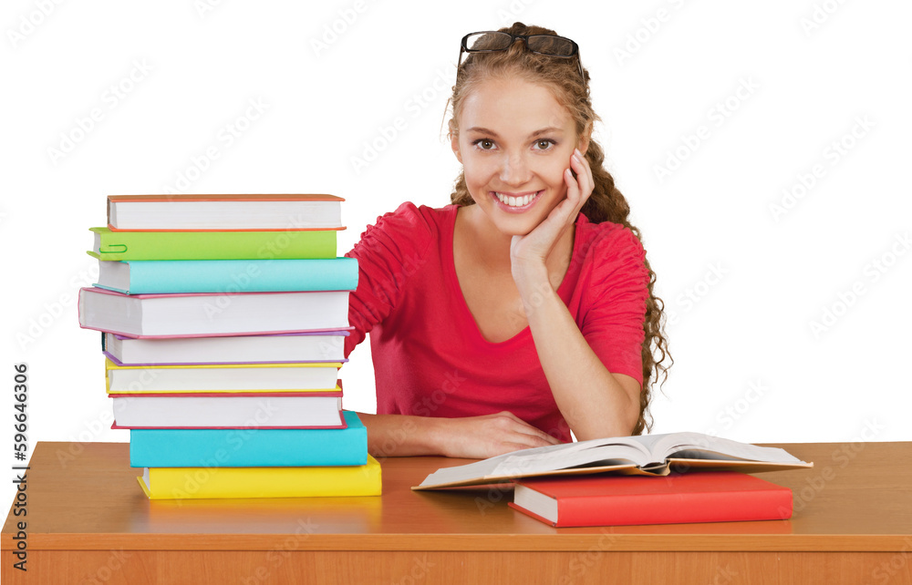 Friendly Young Girl Sitting Behind a Desk with a Books - Isolated Friendly Young Girl Sitting Behind a Desk with a Books - Isolated