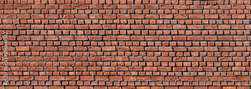 Old damaged red brick wall. Panoramic brickwork texture