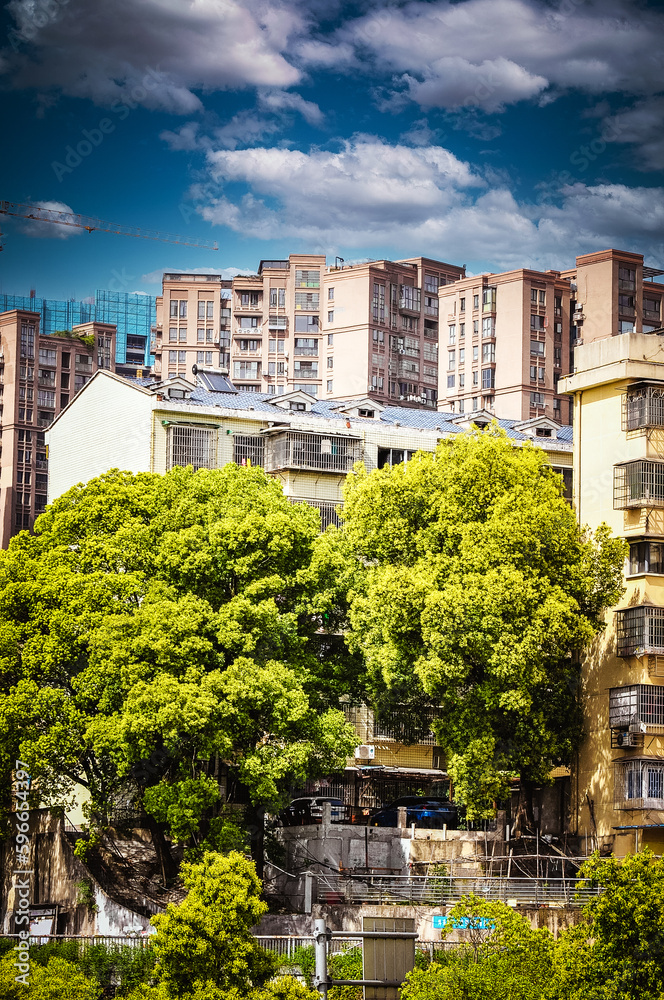 Naklejka premium The modern architectural complex next to West Lake Park in Changsha, Hunan, China was photographed at West Lake Park in Yuelu District, Changsha City.
