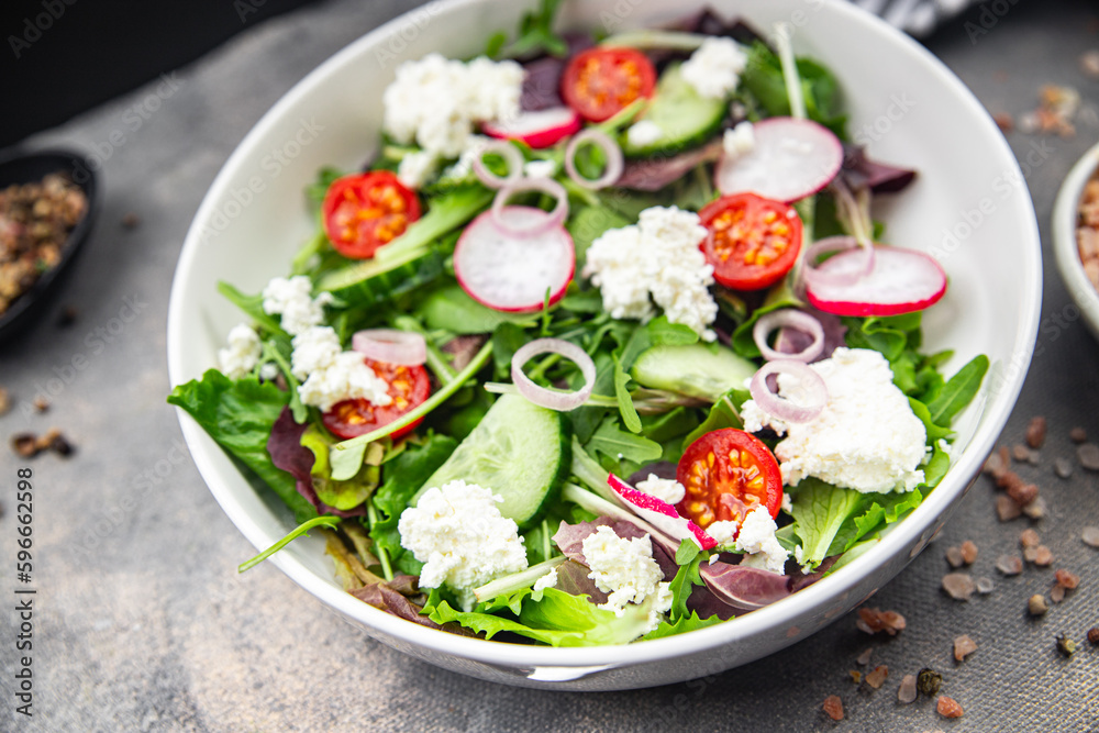 salad cheese, vegetable radish, tomato, cucumber, green lettuce mix green meal food snack on the table copy space food background rustic top view salad cheese, vegetable radish, tomato, cucumber, green lettuce mix green meal food snack on the table copy space food background rustic top view
