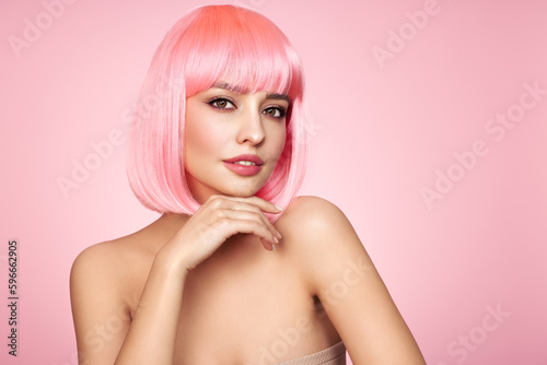Beauty model portrait with pink hair. Bob short Haircut. Beautiful glamour Girl with short dyed hair
