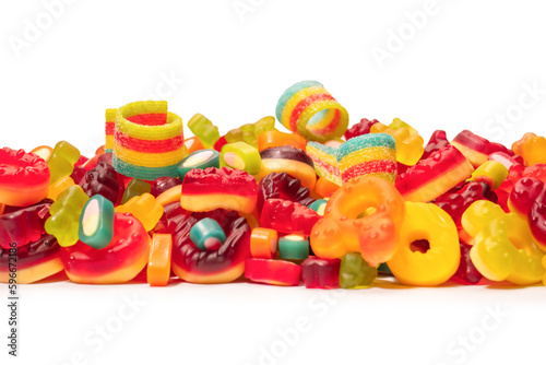 Assorted colorful gummy candies. Top view. Jelly donuts. Jelly bears. Isolated on a white background.