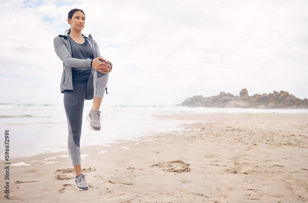 Add some variation to your workout sessions by heading to the beach. Shot of a sporty young woman stretching her legs while exercising on the beach. Add some variation to your workout sessions by heading to the beach. Shot of a sporty young woman stretching her legs while exercising on the beach.