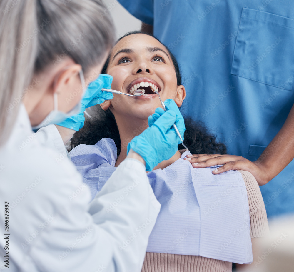 No skimping on the work. Shot of a young woman having a dental checkup. No skimping on the work. Shot of a young woman having a dental checkup.
