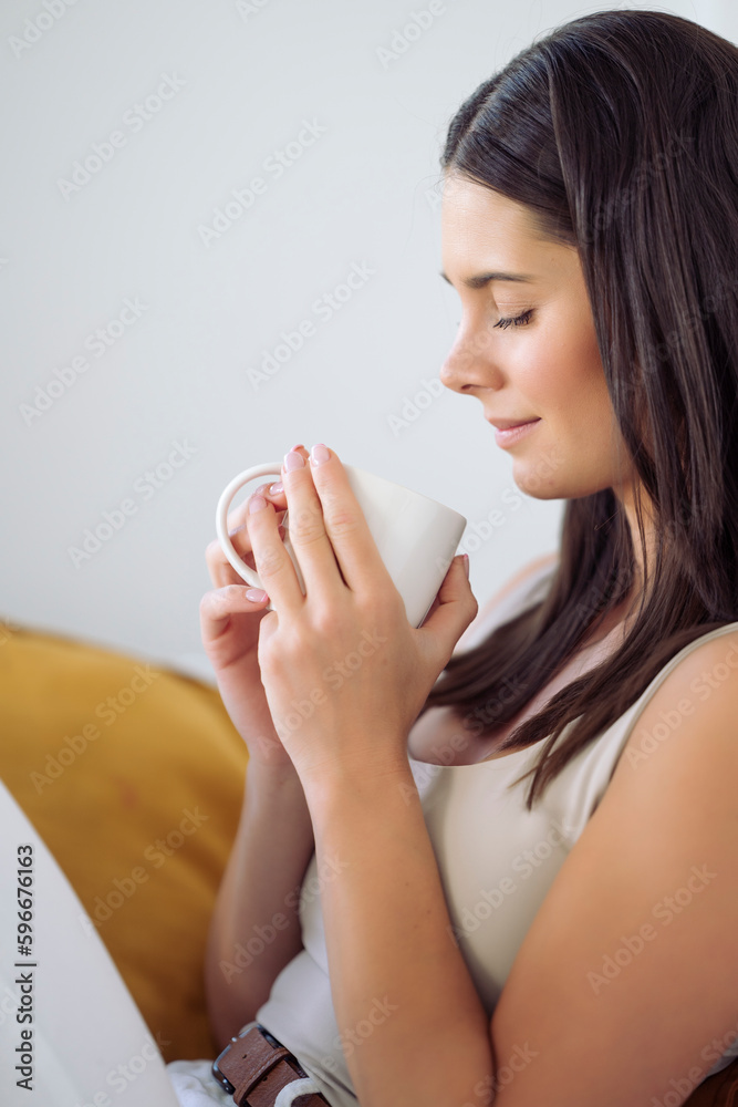 Woman with cup of coffee or tea in a relaxed afternoon Woman with cup of coffee or tea in a relaxed afternoon
