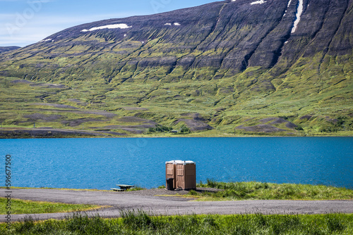 Toilet over Ljosavatn lake known as Mirror Lake in north part of the country, Iceland photo