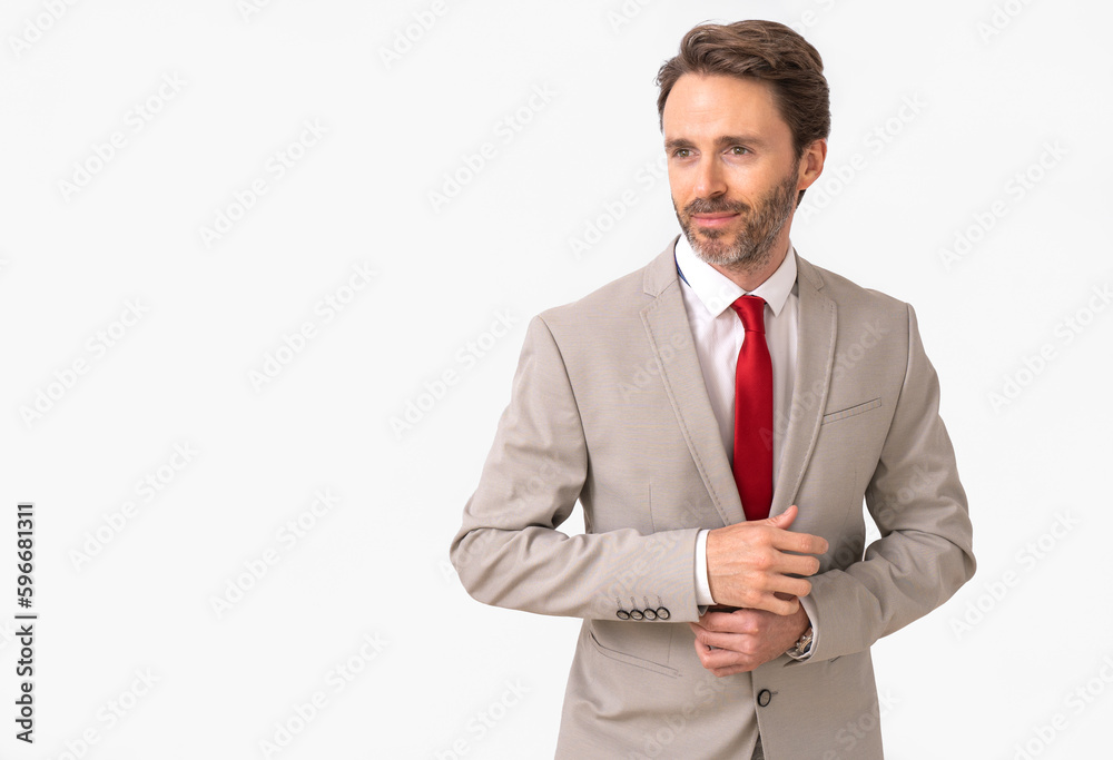 Handsome male model posing wearing a silver suit and a red tie. Handsome male model posing wearing a silver suit and a red tie.