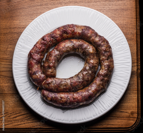 Baked tradotional homemade sausage in natural pork intestine photo