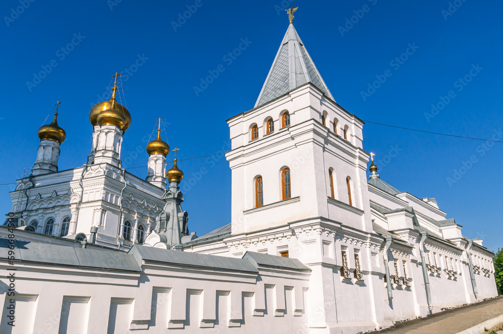 Perm Holy Trinity Stefan Monastery. A monastery for men. An ancient white-stone monastery against a blue sky. The White Church. The place of religious ceremonies.