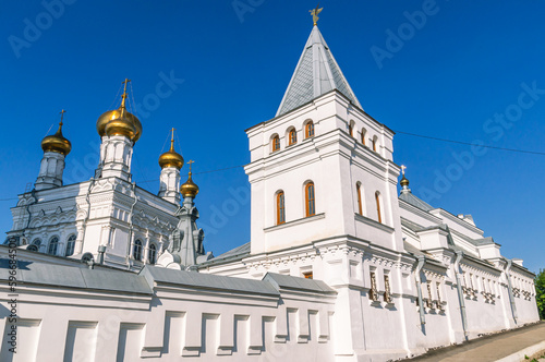 Perm Holy Trinity Stefan Monastery. A monastery for men. An ancient white-stone monastery against a blue sky. The White Church. The place of religious ceremonies.