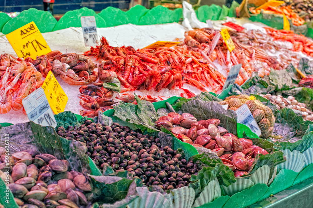 Fototapeta premium Seafood Wonderland: Exploring the Bountiful Delights of Boqueria Market's Fish Stalls in Barcelona