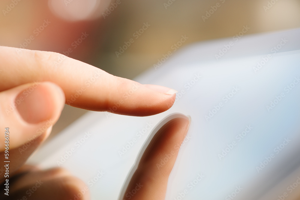 Obraz premium Youll never catch me slacking. Shot of a woman teleworking in a cafe using a digital tablet.