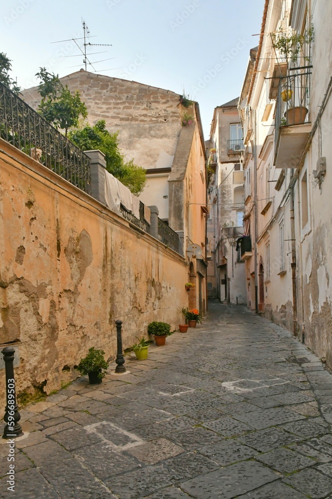 A narrow street among the old houses of Sessa Aurunca, a small town of Caserta province, Italy.