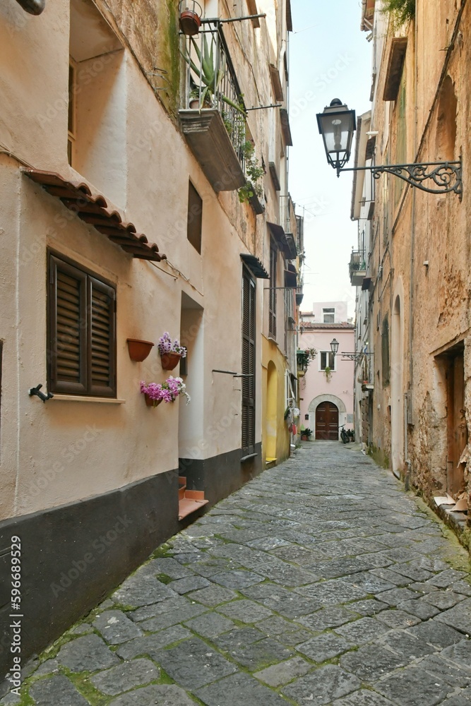 A narrow street among the old houses of Sessa Aurunca, a small town of Caserta province, Italy.