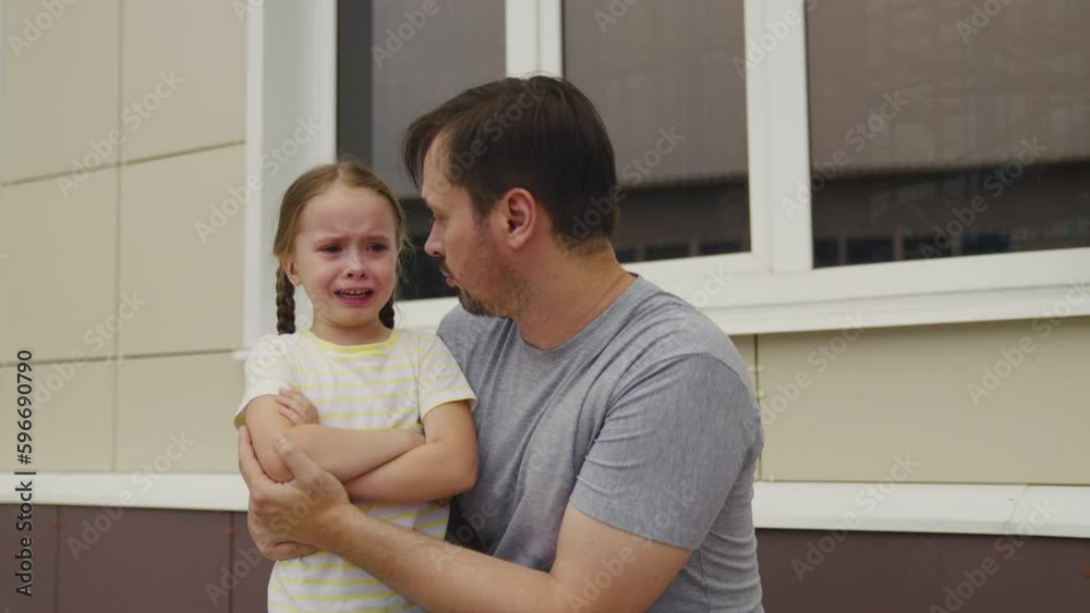 little girl makes scandal her dad. Upset Child throws temper tantrum