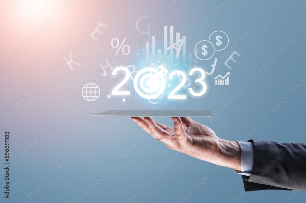 2023 concept, business person hold numbers with target 2023 concept, business person hold numbers with target