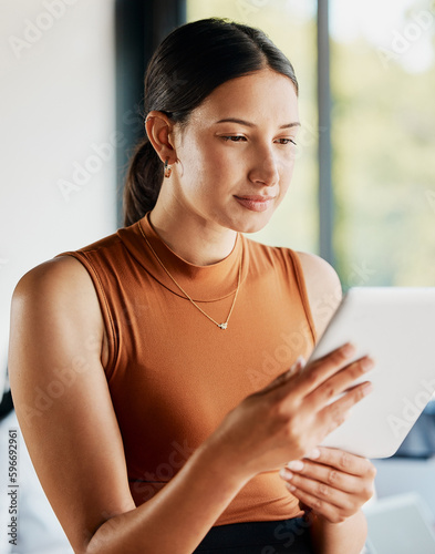 Checking her favourite online resources. Cropped shot of an attractive young businesswoman using a tablet while standing in the office. Free Download Checking her favourite online resources. Cropped shot of an attractive young businesswoman using a tablet while standing in the office. - GFXLoad
