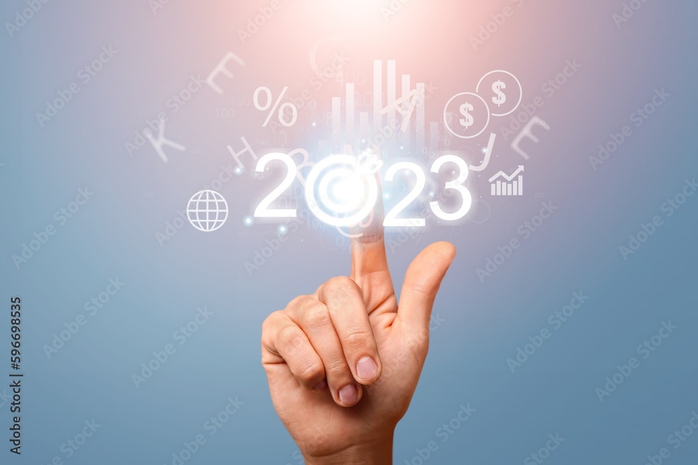 2023 concept, business person hold numbers with target 2023 concept, business person hold numbers with target