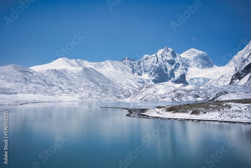 Gurudongmar Lake with snow covered and beautiful lake view one of the best place to visit and enjoy during vacation. Snow capped mountains with breath taking view and is perfect for wallpaper © VISWA