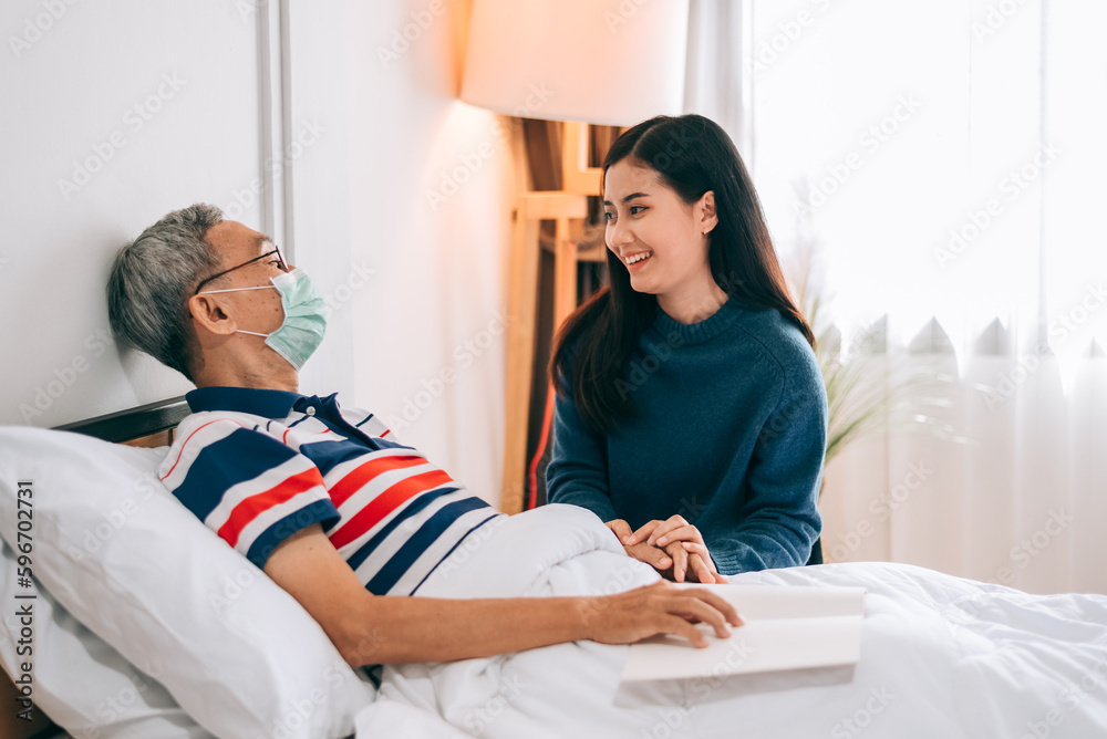 Asian people at patient room in hospital,caregiver and elder man talking together after health check up. Asian people at patient room in hospital,caregiver and elder man talking together after health check up.
